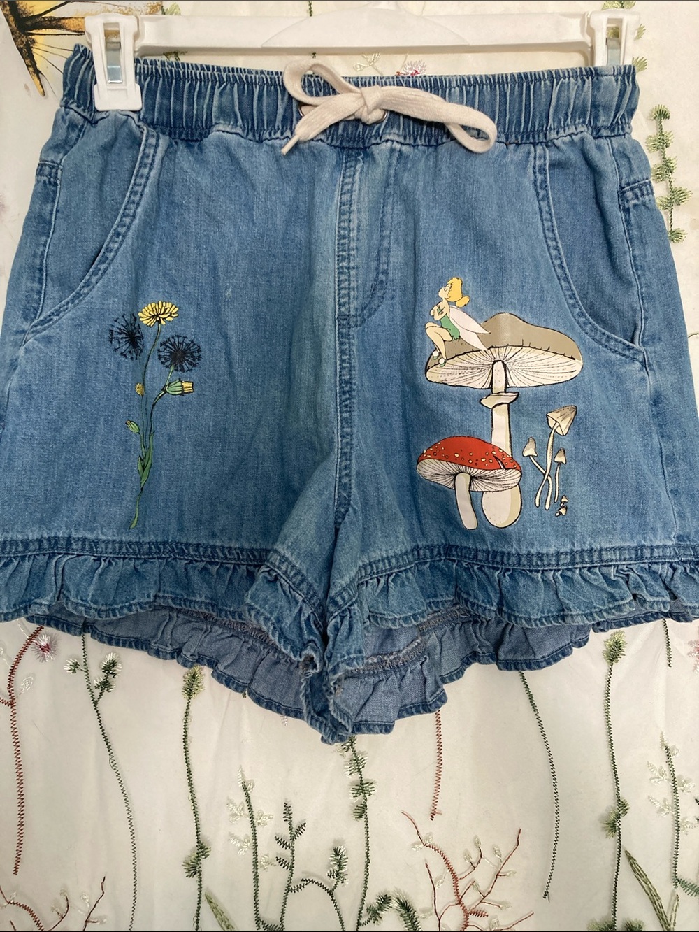 Light Blue Denim Ruffle-Hem Shorts with Mushroom & Floral Appliqué